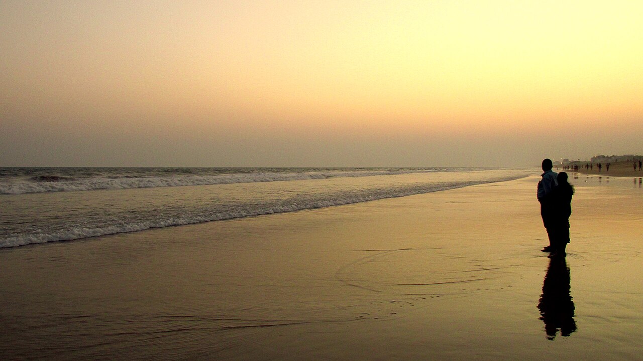Visitors on Puri Beach at sunset